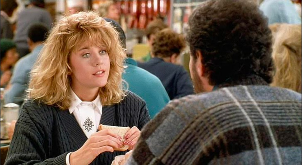 Meg Ryan em cena de Harry e Sally - Feitos Um para o Outro (1989) — Foto: Reprodução