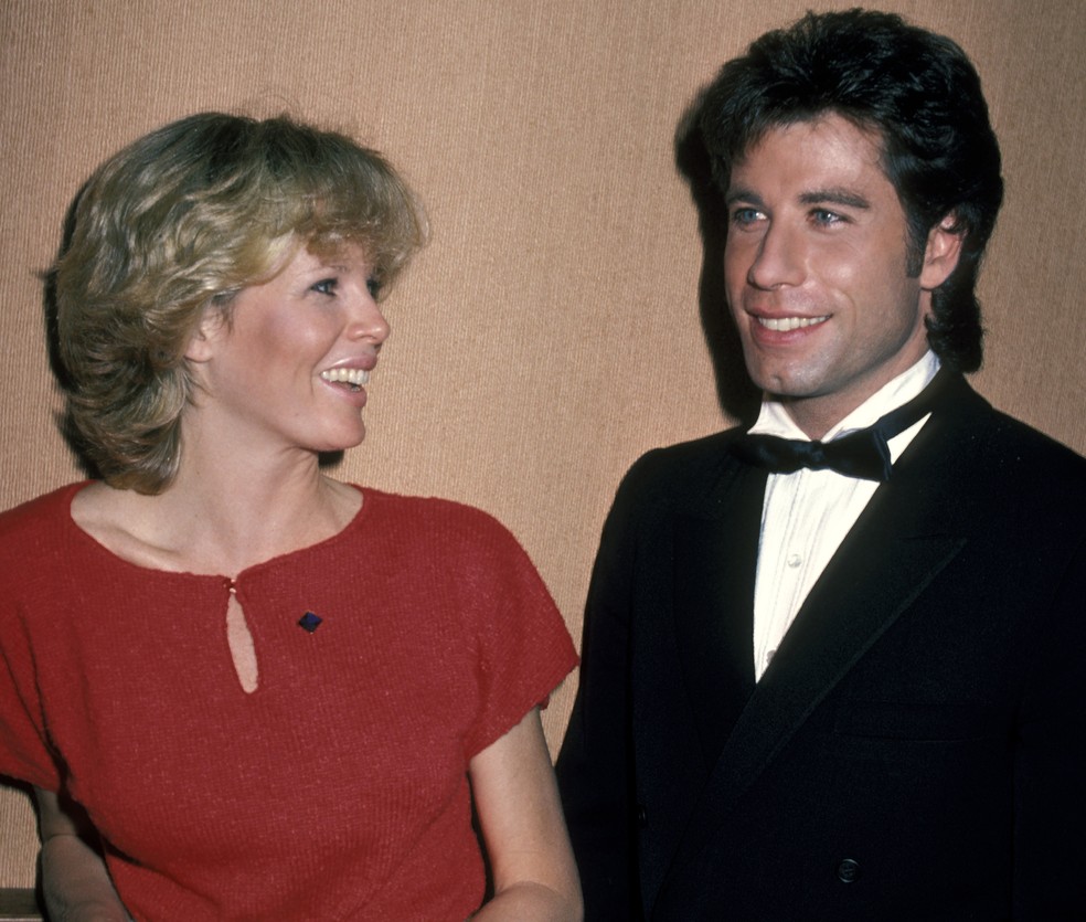 Kim Basinger e John Travolta em 1983 — Foto: Getty Images
