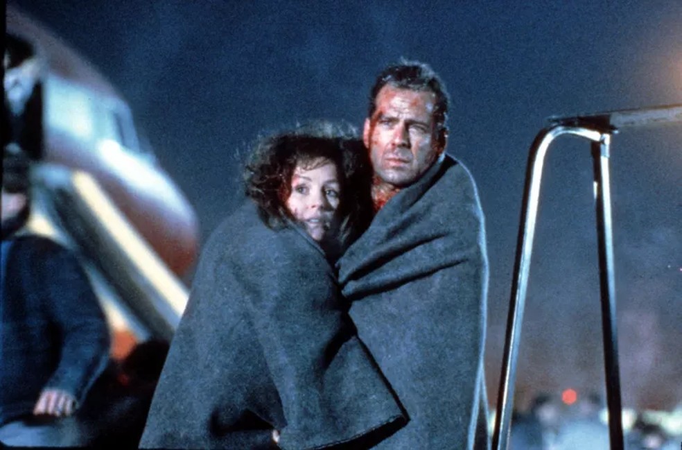 Bonnie Bedelia e Bruce Willis atuaram juntos em Duro de Matar (1988) — Foto: divulgação