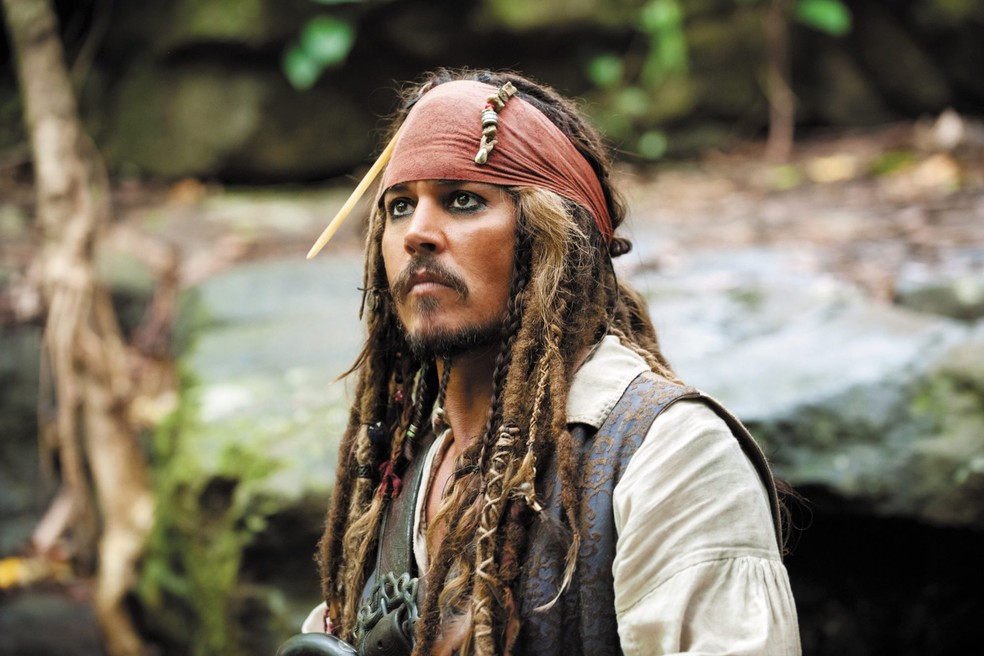 Johnny Depp como Jack Sparrow na franquia Piratas do Caribe — Foto: Divulgação