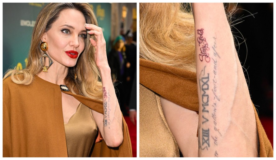 Angelina Jolie no lançamento da peça 'The Outsiders'; em destaque a nova tattoo ('Stay Gold')